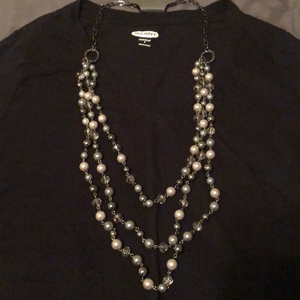 Beaded triple strand long necklace.